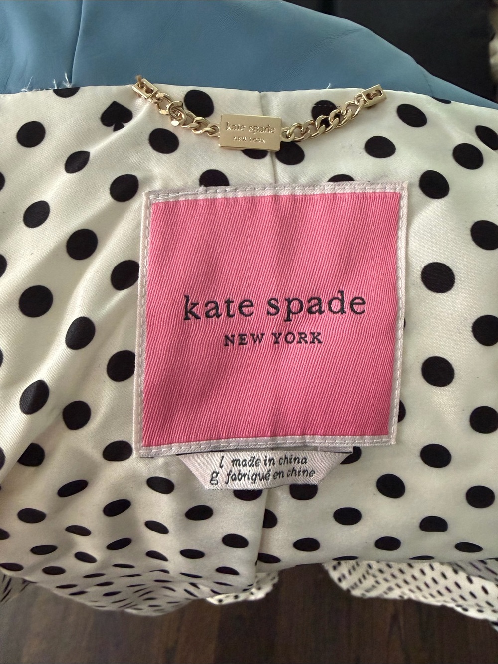 kate spade blue raincoat with Polka Dot Lining.
